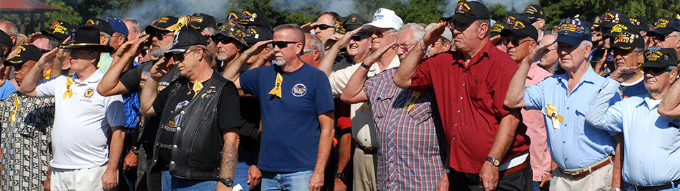 Vietnam veterans stand during a 15-shot salute on Fort Knox, Kentucky. (U.S. Army)