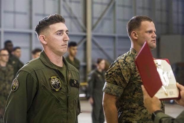 Sgts. Ethan Mintus and Joseph Latsch were awarded the Navy and Marine Corps Achievement Medal with the newly authorized Remote Impact “R” Device  at Marine Corps Air Station Kaneohe Bay, Dec. 11, 2017. (Marine Corps photo)