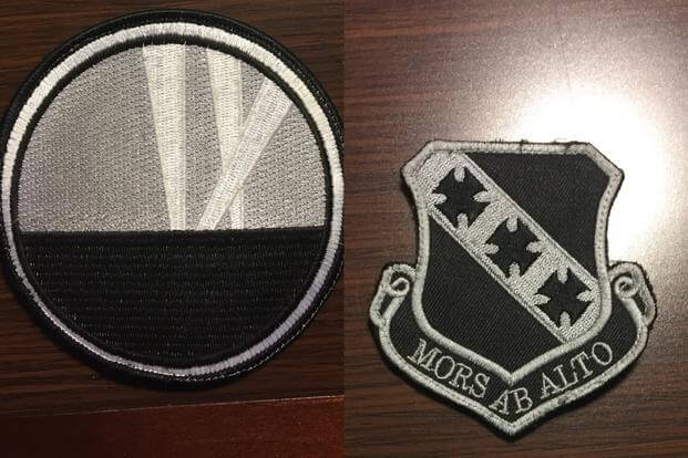 L: 9th Bomb Squadron insignia shows spotlights representing the unit's three major World War I campaigns; R: "Mors Ab Alto" (death from above) patch representing 7th Bomb Wing. (Photo by Military.com/Oriana Pawlyk)