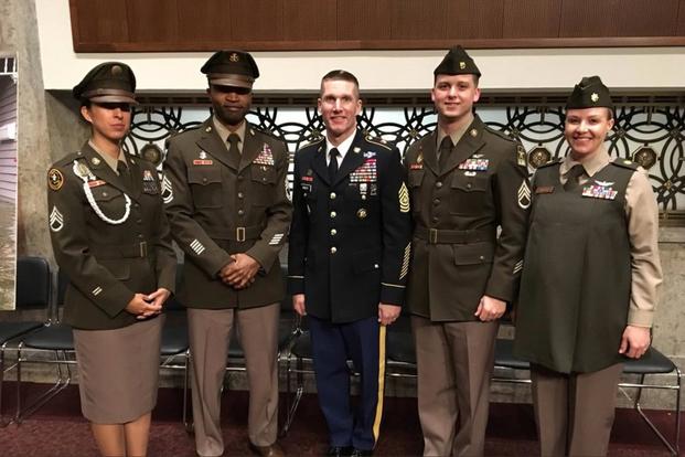 Four soldiers and Sergeant Major of the Army Dan Dailey display the "pinks and greens" uniform prototypes on Capitol Hill, February 1, 2018. (U.S. Army)
