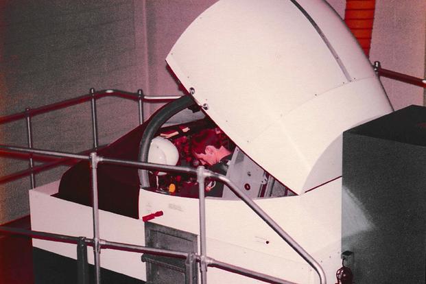 One of Eugene Taylor's trainees at Vance AFB, Oklahoma, straps into a flight simulator, circa 1978-79. (Photo courtesy of Eugene Taylor)