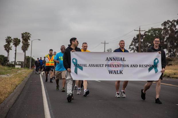 U.S. Marines and Sailors with 1st Marine Logistics Group participate the Sexual Assault Prevention and Response Walk at Camp Pendleton, Calif., April 27, 2018. (U.S. Marine Corps/Pfc. Timothy Shoemaker)