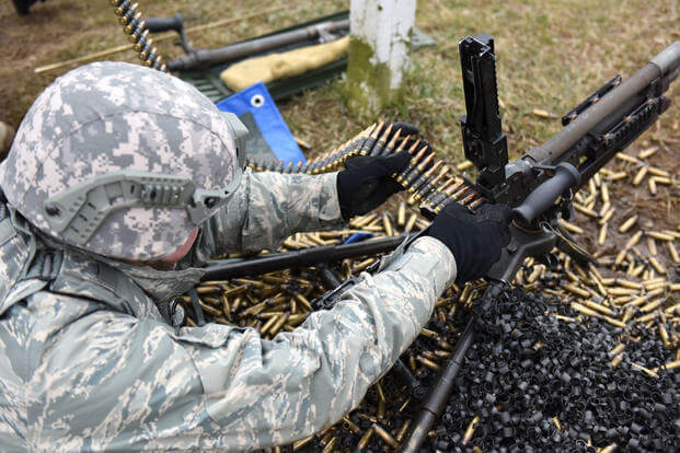 A security forces technician assigned to the 180th Fighter Wing, Ohio Air National Guard, conducts live-fire training using the M-240B, a belt-felt, gas-operated machine gun that shoots 7.62mm rounds, April 18, 2018. (Air National Guard photo/John Wilkes)
