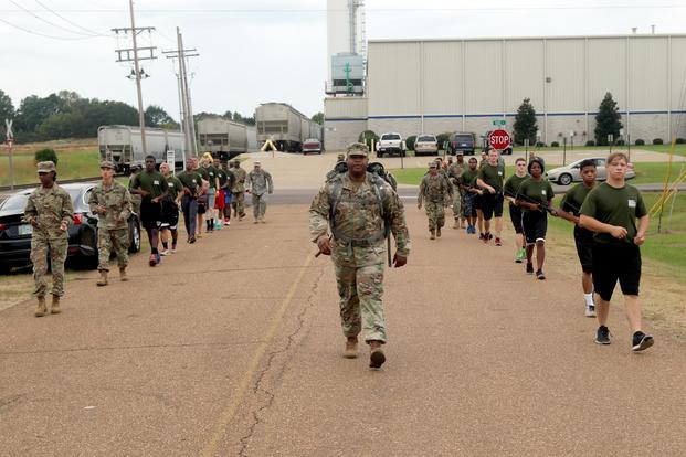 A drill sergeant with the Mississippi National Guard Recruiting and Retention Battalion leads the warriors of the Senatobia Recruit Sustainment Program during a road march Oct. 7, 2017. (U.S. National Guard/Staff Sgt. Scott Tynes)