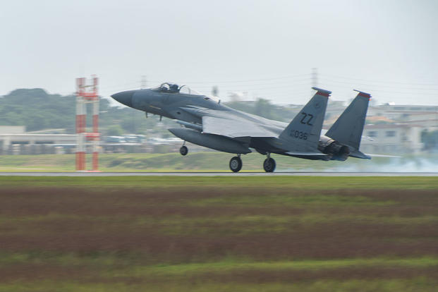 A U.S. Air Force F-15 Eagle from the 67th Fighter Squadron lands on the runway Nov. 16, 2016, at Kadena Air Base, Japan. (U.S. Air Force photo/Corey M. Pettis)