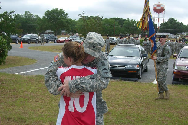 Kelly McHugh-Stewart hugs her father, Army Colonel John McHugh. (Courtesy of Kelly McHugh-Stewart)