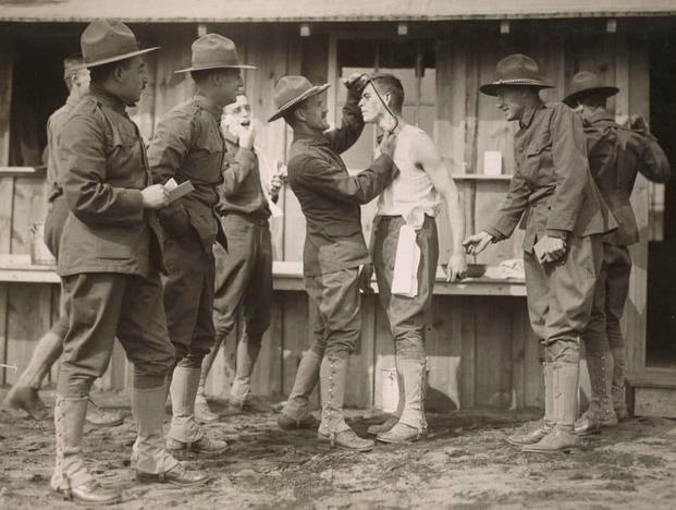 A soldier gets some assistance with shaving his "strong" beard at the Plattsburg, New York, training camp. Note that in World War I, the brown rounds weren't restricted to training cadre. (Photo: National Archives and Records Administration)