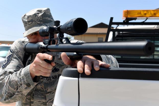 U.S. Air Force Master Sgt. Brett Pate, 317th Airlift Wing flight safety noncommissioned officer, aims an airsoft rifle into a field at Dyess Air Force Base, Texas, May 15, 2018. (U.S. Air Force/Airman 1st Class Mercedes Porter)