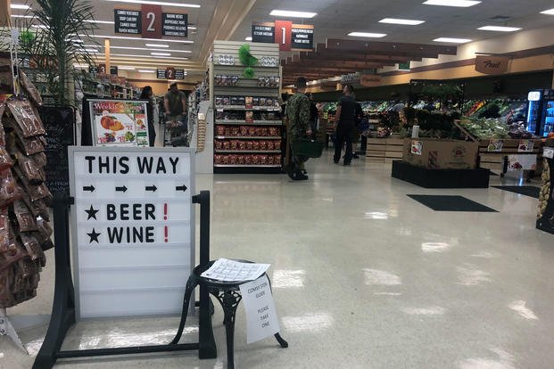 A sign at Port Huememe, California points shoppers to the store's beer and wine selection. (Photo: Military.com)