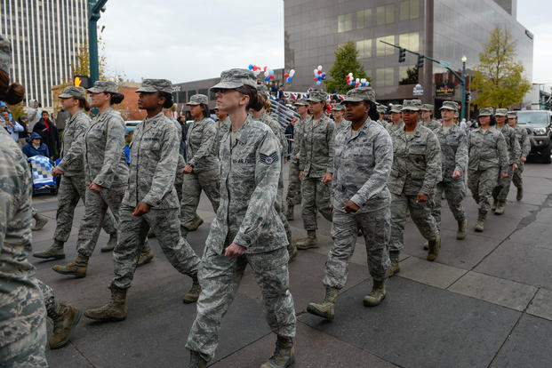 Airmen walk during the Colorado Springs Veterans Day Parade in Colorado Springs, Colorado, Nov. 5, 2016. The all-female Airmen flight represented Schriever during the women in military themed parade. (U.S. Air Force photo/Christopher DeWitt)