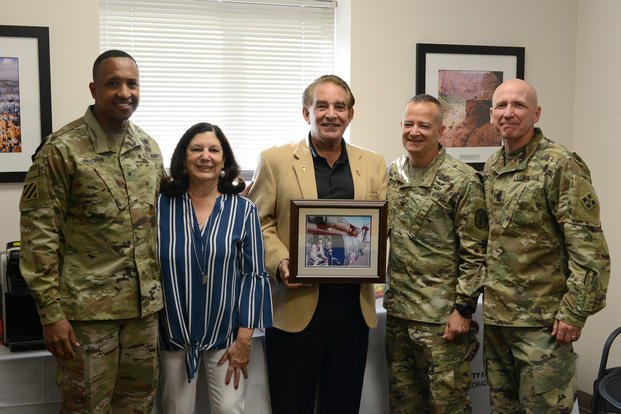 4th Inf. Div. and Fort Carson Deputy Commanding General William L. Thigpen, Evans Army Community Hospital Commander Col. Eric S. Edwards and 4ID Command Sgt. Maj. Frank Handoe meet with Carol and Tony DiRaimondo at the DiRaimondo Family Medicine Clinic Sept. 27, 2018, at Fort Carson, Colorado. The DiRaimondo family presented a picture of their son to the DiRaimondo Family Medicine Clinic.  (U.S. Army/ Jeanine Mezei)