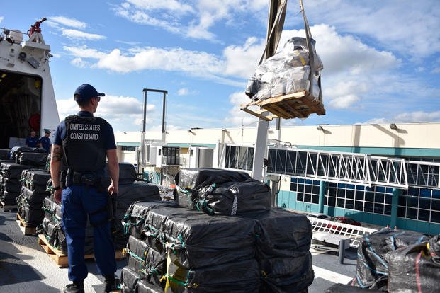 A pallet of interdicted cocaine is offloaded from the Coast Guard Cutter James (WMSL-754) by crane Nov. 15, 2018 in Port Everglades, Florida. (U.S. Coast Guard photo/Brandon Murray)
