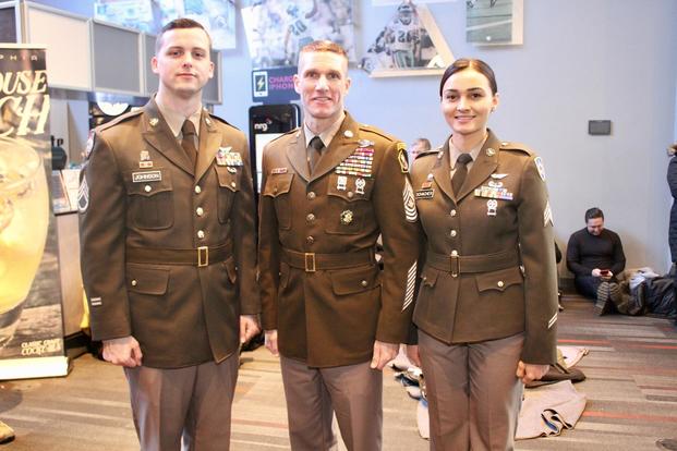Sergeant Major of the Army Dan Dailey stands with Soldier models wearing the proposed Pink & Green daily service uniform at the Army-Navy game in Philadelphia, Pennsylvania December 9, 2017. (US Army photo by Ron Lee)