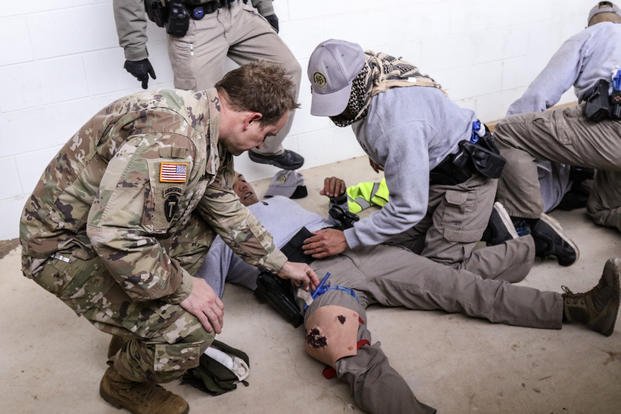 Texas National Guard Joint Counterdrug Task Force member, Staff Sgt. Quincy Tidwell adjusts a tourniquet during training in Florence, Texas, Oct. 15, 2018. Since 2017, Texas National Guard Counterdrug Task Force members have provided support for the Department of Public Safety’s Tactical Emergency Casualty Care training by implementing their first-hand military experience for roughly 500 recruits and several multi-agency classes across the state. (Nadine Wiley De Moura/Texas Joint Counterdrug Task Force)