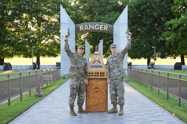FORT BENNING, Ga. -- From left, Capts. Michael Rose and John Bergman of the 101st Airborne Division pose at the Ranger Monument April 15, 2019 at Fort Benning, Georgia. (U.S. Army/Markeith Horace, Maneuver Center of Excellence, Fort Benning Public Affairs)
