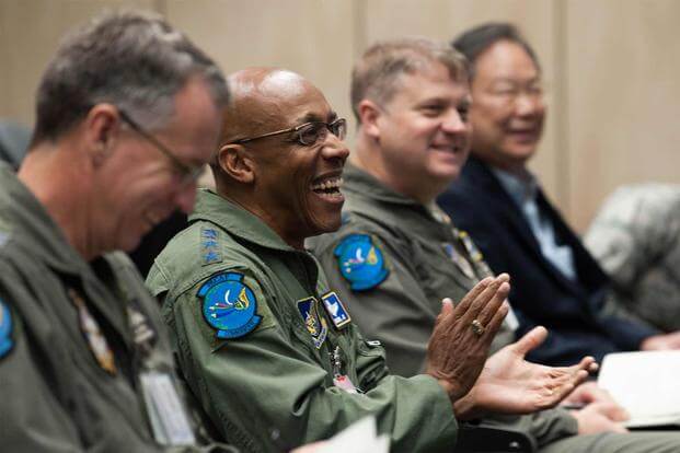 Gen. CQ Brown, Jr. attends a briefing by Air Commodore Rob Chipman.
