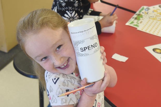 child with her "spend" container