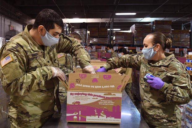 Washington National Guard packs food boxes.