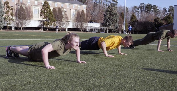 Navy ROTC cadets work out.