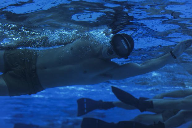 An airman in the Special Tactics Training Squadron swims.