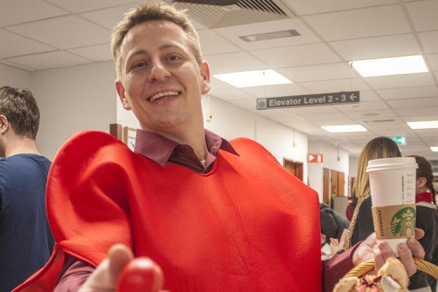 A health-care specialist dresses up as a heart.