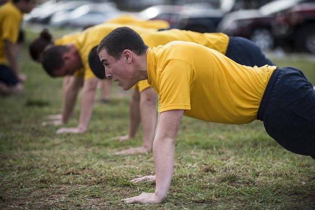 Sailors perform push-ups as part of the Navy's physical readiness test in San Diego.