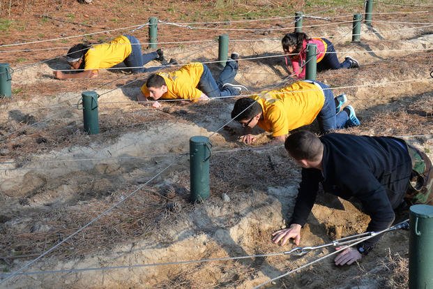 Junior Navy ROTCs cadets run Naval Special Warfare Group TWO’s obstacle course.