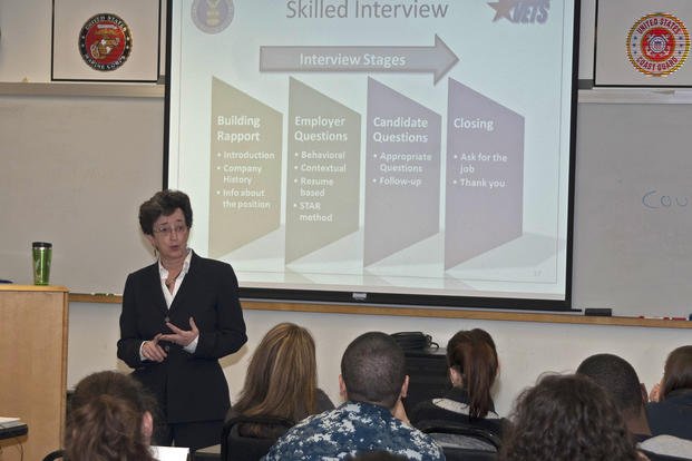 Gale Kennedy, an instructor for the Transition Assistance Program, discusses job interview techniques with sailors during a TAP class at Smokey Point Naval Support Complex.