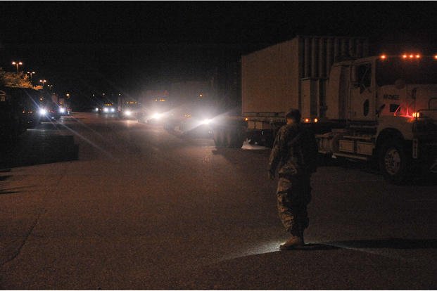 After 600 miles of driving, all 33 trucks from the 1067th Transportation Company, 728th Combat Support Sustainment Battalion, 213th Regional Support Group, Pennsylvania Army National Guard, roll into the rest stop for the night at Volk Field, Wis.