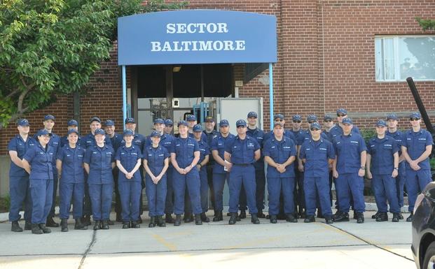 Crewmembers of the Coast Guard Sector Baltimore Response department pose for a photo at the Coast Guard Yard in Baltimore before starting their two-day marina outreach to kick off National Safe Boating Week, Saturday, May 19, 2011. 