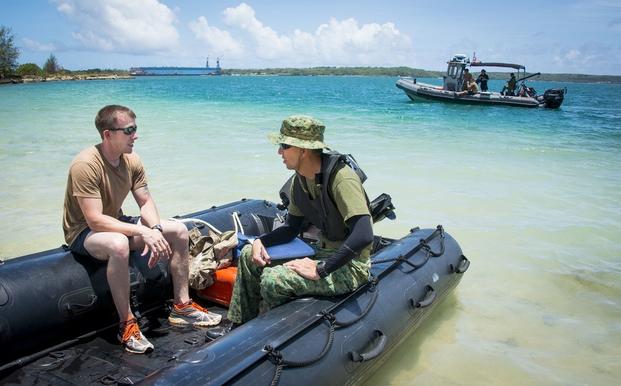 U.S. Navy and Republic of Singapore Navy (RSN) Sailors discuss training evolutions during the Miata Exercise on Naval Base Guam, May 18, 2015. 