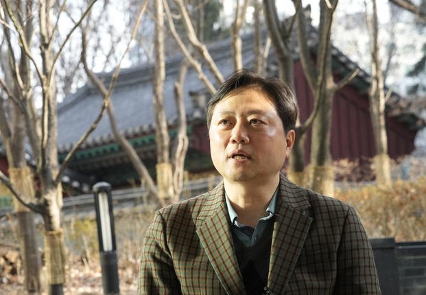 Min Seungki, an electronics company manager, speaks during an interview in Seoul, South Korea