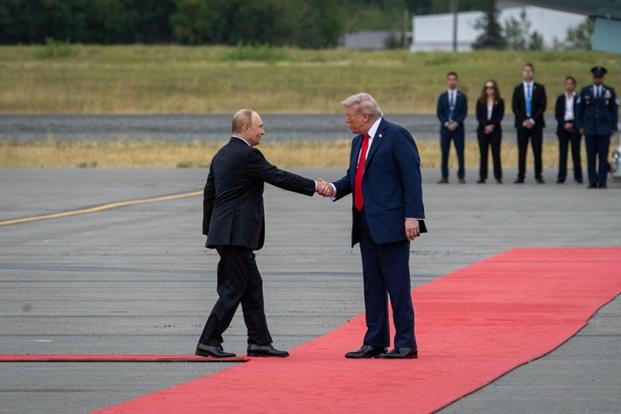 U.S. President Donald J. Trump and Russian President Vladimir Putin greet each other at Joint Base Elmendorf-Richardson, Alaska, Aug. 15, 2025. (U.S. Air Force photo by Airman 1st Class Moises Vasquez).