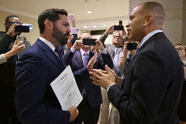Rep. Michael Lawler, R-N.Y., left, confronts House Minority Leader Hakeem Jeffries, D-N.Y., in a heated discussion to endorse House bill H.R.5145 that would extend the American Rescue Plan Act of 2021 (ARPA) and the Inflation Reduction Act of 2022 at the U.S. Capitol on Wednesday, Oct. 8, 2025, in Washington. (John McDonnell/AP Photo) Rep. Michael Lawler, R-N.Y., left, confronts House Minority Leader Hakeem Jeffries, D-N.Y.