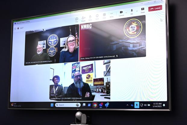 Dr. Richard Arnold, director of the Naval Aerospace Medical Research Laboratory, and Dr. Karen Mumy, director of the Environmental Health Effects Laboratory, participate in a virtual interview with Naval Medical Research Command staff for a command profile for NMRC’s SCOPE newsletter, Jan. 14, 2025, at Wright-Patterson Air Force Base, Ohio. (Zachary Wilson/Navy) Three windows open in a virtual meeting.