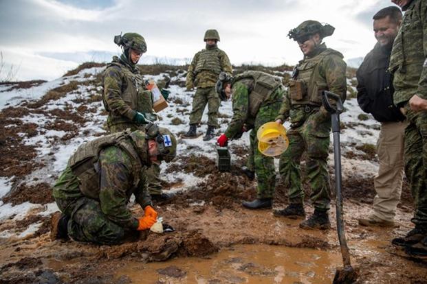 U.S. and Finnish Explosive Ordnance Disposal (EOD) soldiers assigned to the NATO-led Kosovo Force mission work alongside the Kosovo Security Forces for proper and safe disposal of unexploded ordnance at the EOD range on Camp Bondsteel, Kosovo, Jan. 7, 2025. This effort is part of KFOR’s daily mission to maintain a safe and secure environment for all people in Kosovo. (U.S. Army National Guard photo by Sgt. Grace Wajler, DVIDS).