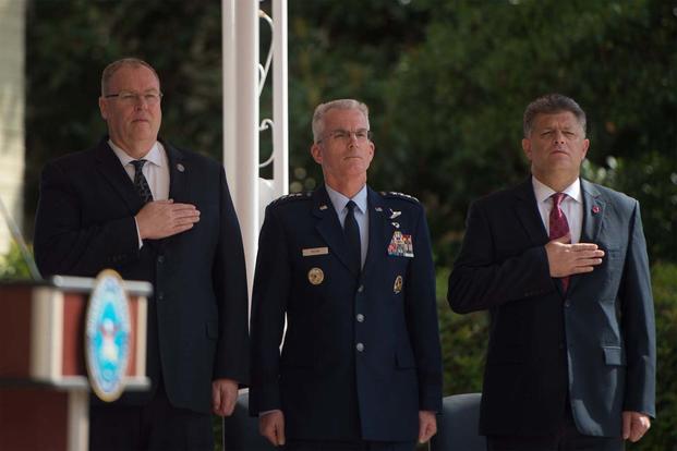 From left, Deputy Defense Secretary Bob Work, Air Force Gen. Paul J. Selva and Michael L. Rhodes honor the flag during a ceremony at the Pentagon marking the 15th anniversary of 9/11, Sept. 9, 2016. (DoD photo by Army Sgt. Amber)