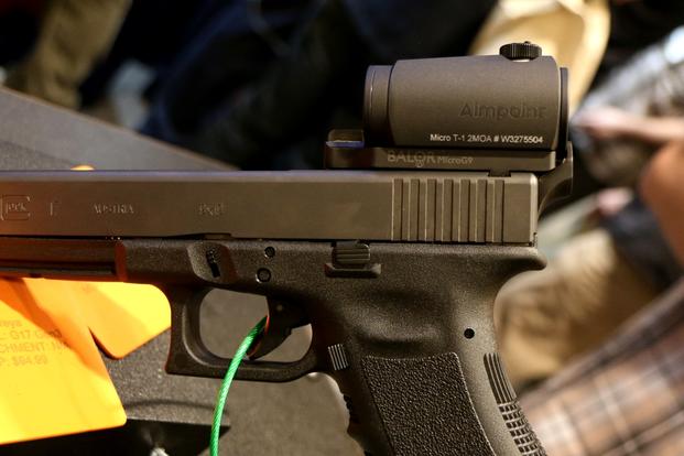 Raven Concealment has a new mount for attaching an Aimpoint Micro T1 or H1 red-dot sight on a Glock or other semi-auto pistols. (Photo by Matthew Cox/Military.com)
