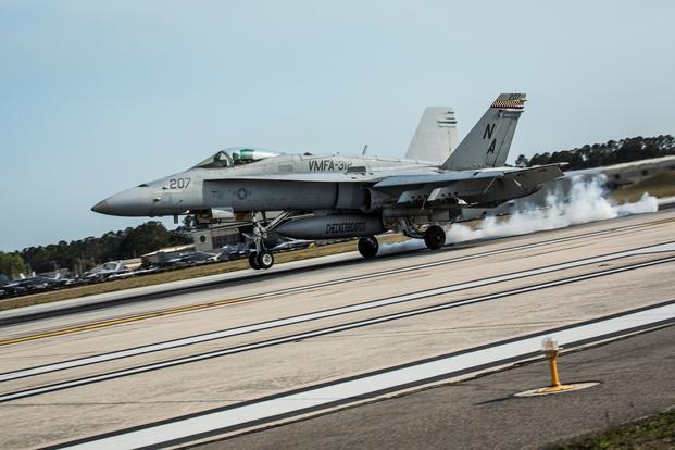 An F/A-18C Hornet aircraft conducts a simulated aircraft carrier landing aboard Marine Corps Air Station Beaufort, March 22, 2017. Ashley Phillips/Marine Corps