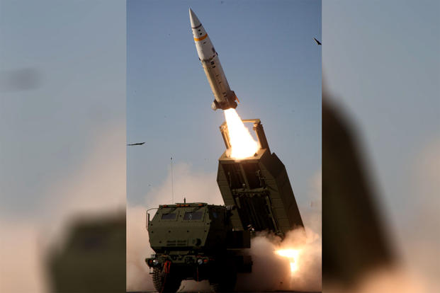 The M57A1 Army Tactical Missile System launches a missile over the cab of an M142 High Mobility Artillery Rocket System launcher. (US Army photo)