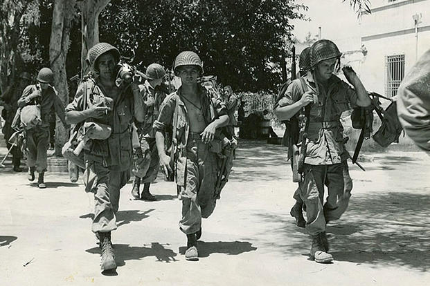Members of the 504th Parachute Infantry Regiment patrol Sicily after capturing the island from Germany in early July, 1943. (U.S. Army photo)