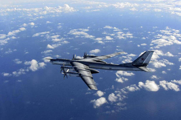File photo provided by Britain's Royal Air Force of a Russian military long range bomber photographed by an intercepting RAF quick reaction Typhoon (QRA) as it flies in international airspace. (AP Photo/Royal AIr Force)