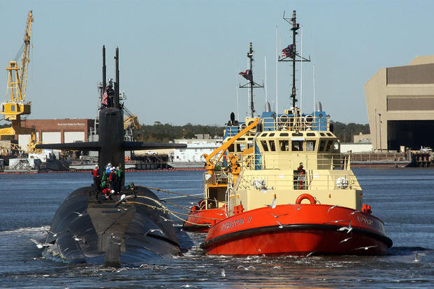 The ballistic-missile submarine USS Rhode Island (SSBN 740) is escorted by tug boats to her berth at Naval Submarine Base Kings Bay, Ga. (US Navy Photo)
