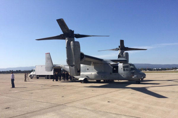 FEMA and Marine Corps officials practice loading gear onto a Marine Corps MV-22 on Tuesday at Moffett Field in California during a training exercise as part of Fleet Week San Francisco.(Photo: Military.com)