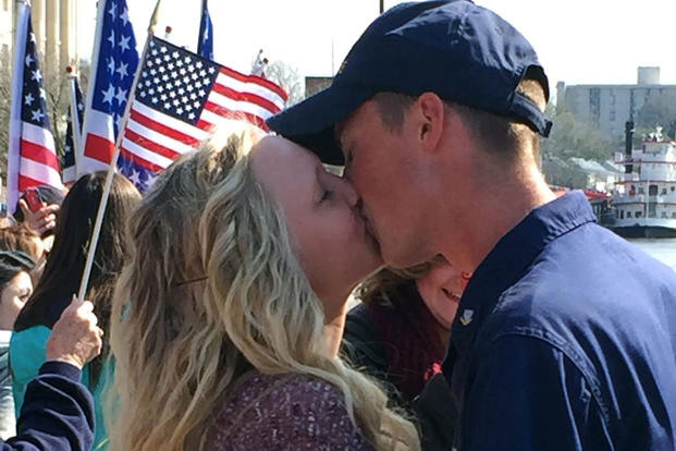 Petty Officer 3rd Class Philip Wert reunites with his fiancée during the Cutter Diligence homecoming March 5, 2016 in Wilmington, North Carolina. (U.S. Coast Guard photo: Mary Ann Holmes/Atlantic Area Ombudsman)