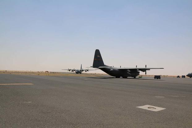 SOUTHWEST ASIA - C-130s, a part of the 386th Air Expeditionary Wing, taxi on the runway. The Hercules' average around 500 sorties, deliver thousands of tons, and transport 9,000 people a month. (Photo: Oriana Pawlyk)