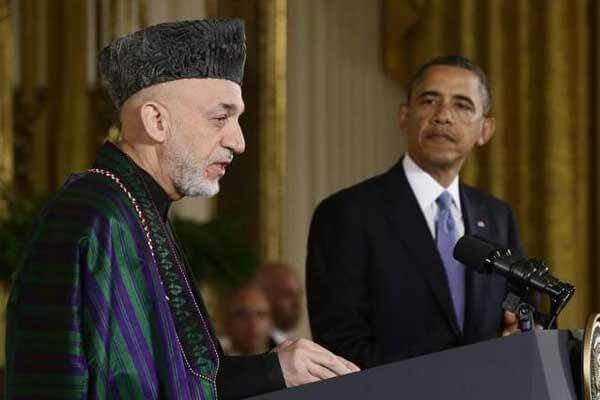 President Barack Obama listens as Afghan President Hamid Karzai speaks during a news conference in the East Room at the White House in Washington, Friday, Jan. 11, 2013. (AP Photo/Charles Dharapak)