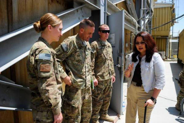 Tammy Duckworth talks with US troops.