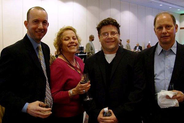 Former Wounded Warrior Care and Transition Policy's Principal Director Philip Burdette (left) is seen here standing for a photo with other Pentagon officials and actor Sean Astin at the Care Coordination Summit in 2011. DoD photo