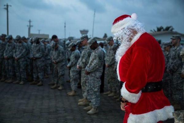 Soldiers deployed to Liberia bow their head ahead of the Christmas holiday. (U.S. Army photo)